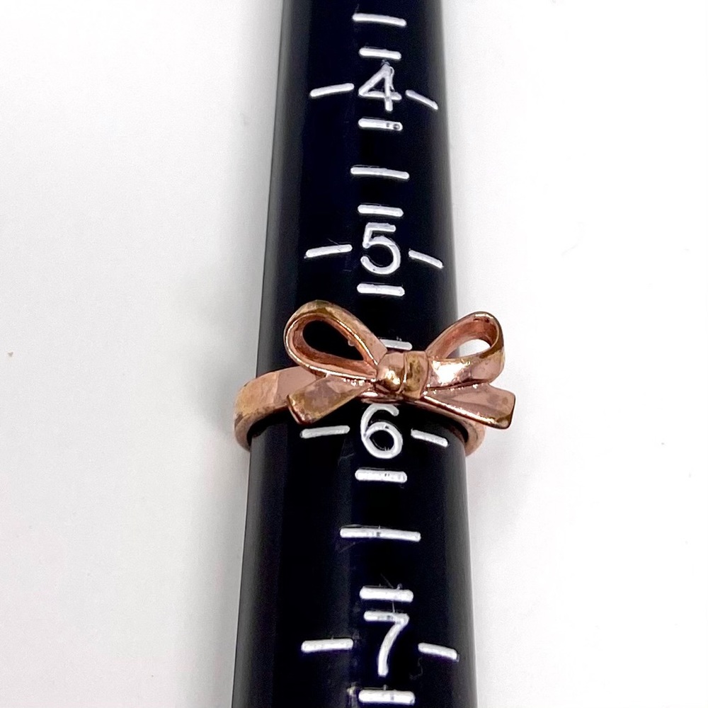 Kate Spade rose gold colored bow ring size 5.5